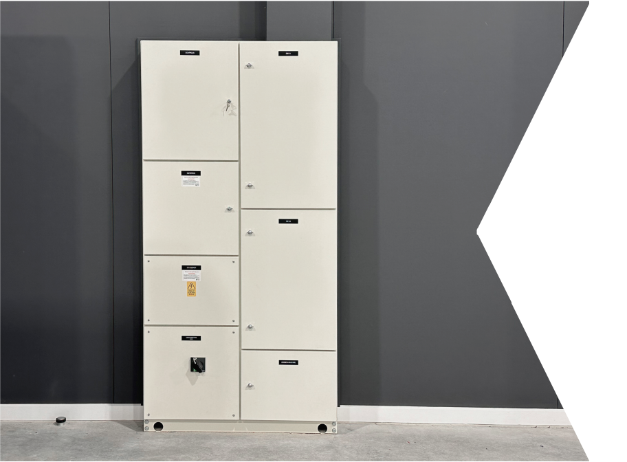 Tall 250A main switchboard in industrial warehouse on dark grey wall