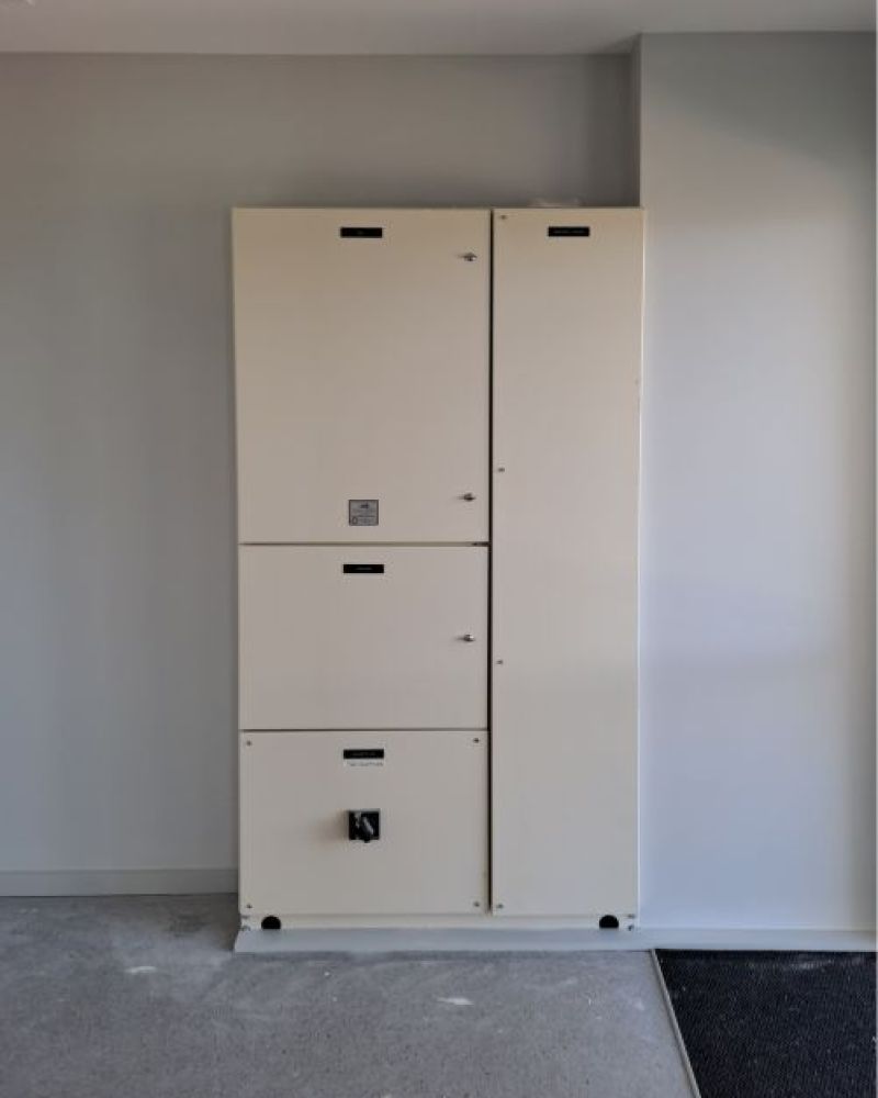Tall switchboard with extended handle in a commercail showroom 